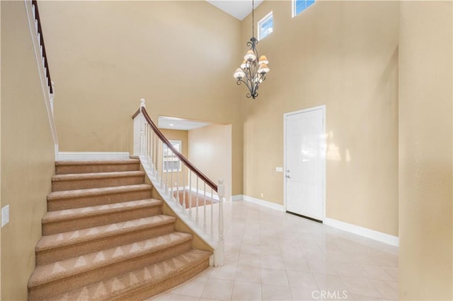 37351 Paintbrush Dr, Palmdale, CA 93551 - stairway featuring a towering ceiling, a chandelier, and tile patterned floors