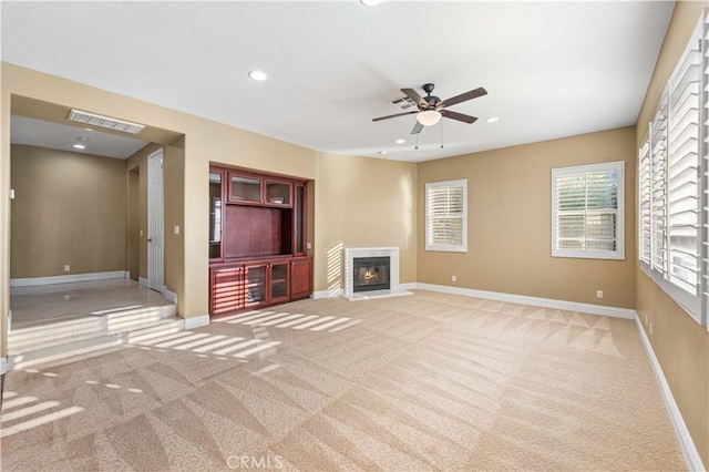 37351 Paintbrush Dr, Palmdale, CA 93551 - unfurnished living room with carpet, a ceiling fan, a glass covered fireplace, and recessed lighting