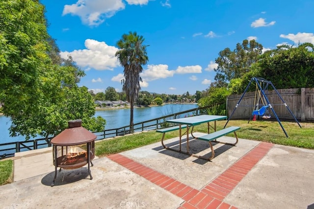 42724 Santa Suzanne Pl, Temecula, CA 92592 - fenced backyard with an outdoor fire pit, a patio area, a playground, and a water view