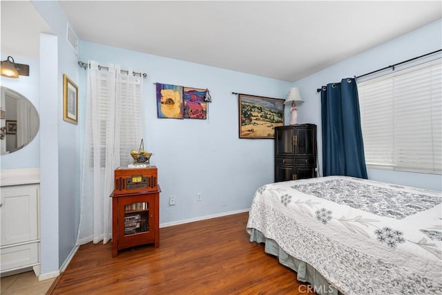 3639 Country Oaks Loop Unit E, Ontario, CA 91761 - bedroom featuring baseboards and wood finished floors