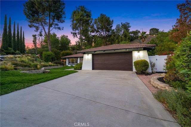 170 Buckthorn Dr, Brea, CA 92823 - mediterranean / spanish house featuring stucco siding, driveway, a garage, and a gate