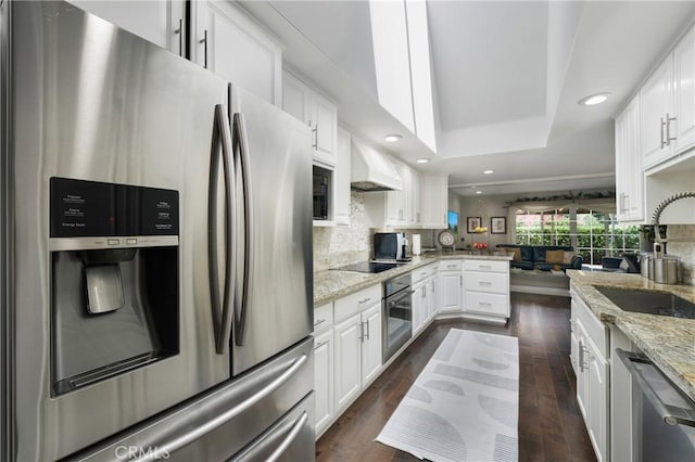 170 Buckthorn Dr, Brea, CA 92823 - kitchen with stainless steel appliances, custom range hood, a raised ceiling, a peninsula, and recessed lighting