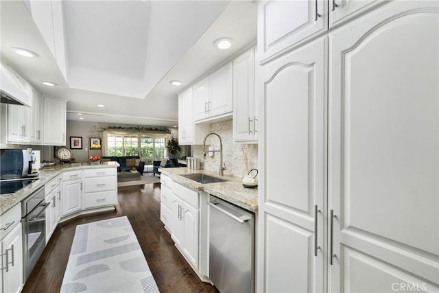 170 Buckthorn Dr, Brea, CA 92823 - kitchen featuring appliances with stainless steel finishes, white cabinetry, light stone counters, recessed lighting, and dark wood-style flooring