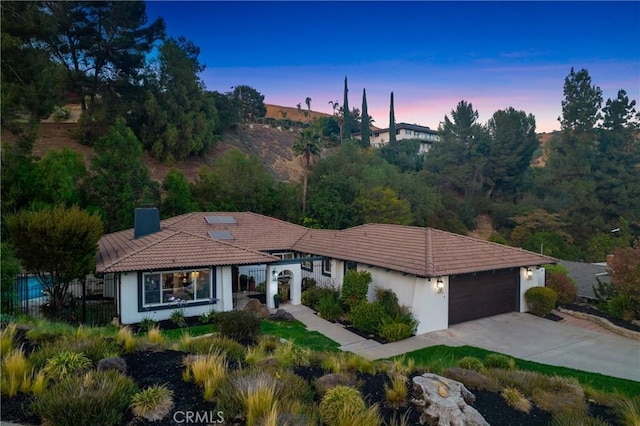 170 Buckthorn Dr, Brea, CA 92823 - view of front of house with an attached garage, concrete driveway, a chimney, and a tiled roof