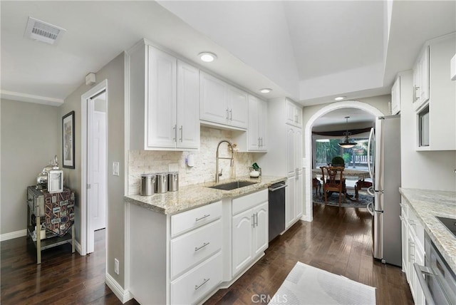 170 Buckthorn Dr, Brea, CA 92823 - kitchen featuring stainless steel appliances, backsplash, dark wood-style floors, white cabinets, and light stone counters