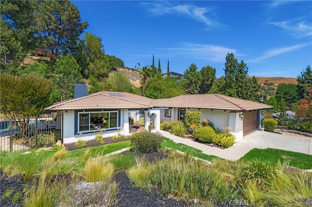 170 Buckthorn Dr, Brea, CA 92823 - ranch-style home featuring a chimney, a tiled roof, concrete driveway, and a garage