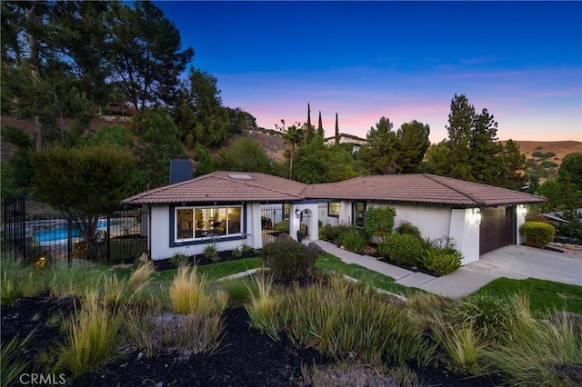 170 Buckthorn Dr, Brea, CA 92823 - view of front of house featuring driveway, a chimney, a garage, and a tile roof