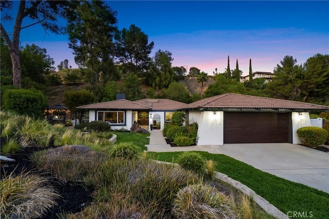 170 Buckthorn Dr, Brea, CA 92823 - view of front facade with a garage, concrete driveway, a chimney, and stucco siding