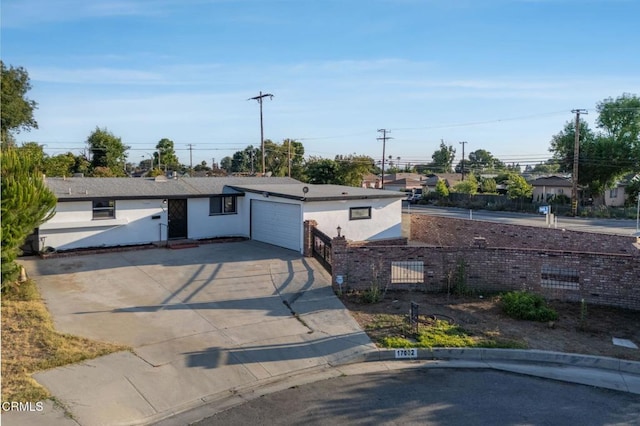 17002 E Nubia St, Covina, CA 91722 - ranch-style house featuring concrete driveway, an attached garage, and stucco siding