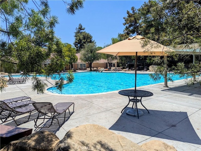 27185 Buffalo Trl, Corona, CA 92883 - community pool featuring a patio