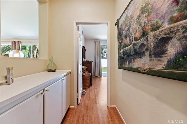 27185 Buffalo Trl, Corona, CA 92883 - corridor featuring light wood-type flooring and healthy amount of natural light