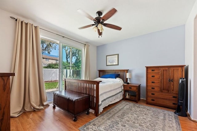 27185 Buffalo Trl, Corona, CA 92883 - bedroom with access to exterior, light wood-style flooring, and a ceiling fan