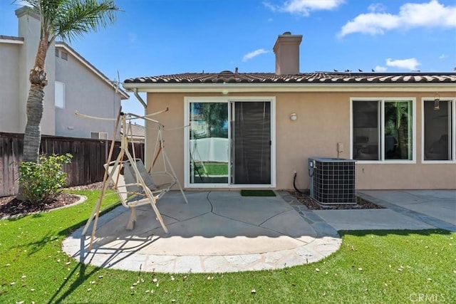 27185 Buffalo Trl, Corona, CA 92883 - back of house with a patio area, stucco siding, a chimney, and a tile roof