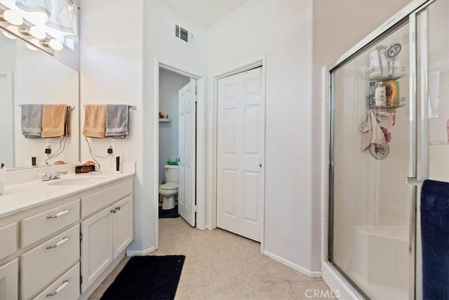 27185 Buffalo Trl, Corona, CA 92883 - full bath featuring a shower stall, vanity, and tile patterned floors