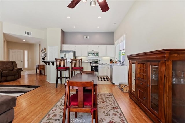 27185 Buffalo Trl, Corona, CA 92883 - dining room with a ceiling fan, light wood-type flooring, and recessed lighting
