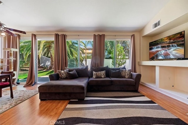 27185 Buffalo Trl, Corona, CA 92883 - living area with wood finished floors and a ceiling fan