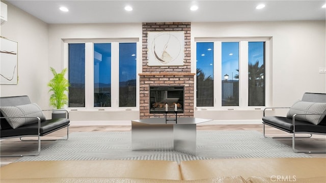 72160 Winters Rd Unit 29, Palms, CA 92277 - living area with wood finished floors, recessed lighting, and a brick fireplace