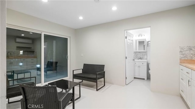 72160 Winters Rd Unit 29, Palms, CA 92277 - sitting room with recessed lighting and a wall mounted air conditioner