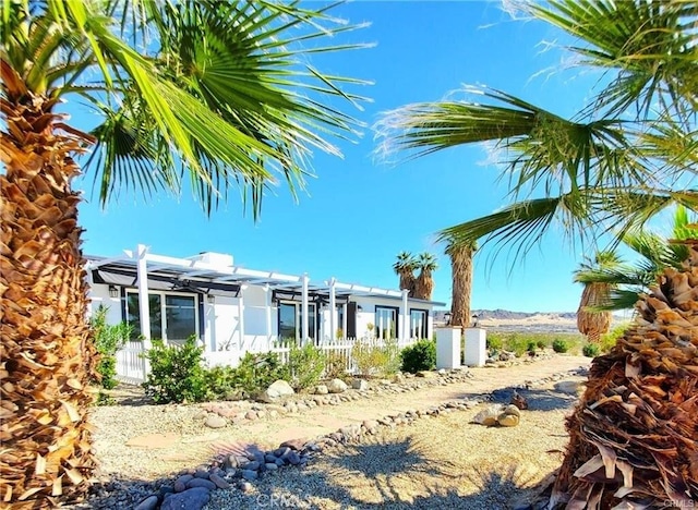 72160 Winters Rd Unit 29, Palms, CA 92277 - view of front of house featuring a pergola and stucco siding