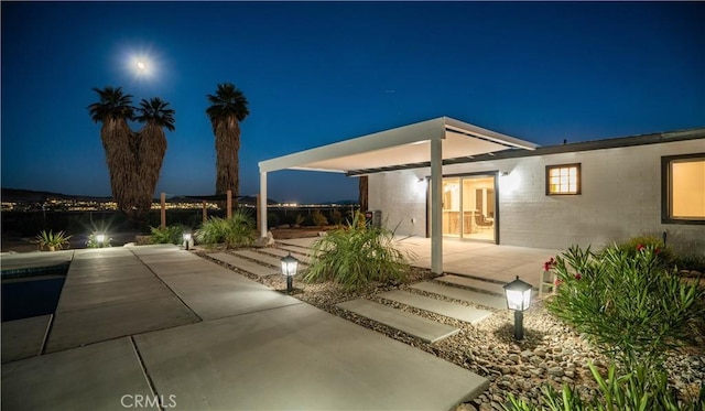 72160 Winters Rd Unit 29, Palms, CA 92277 - back of house at night featuring a patio