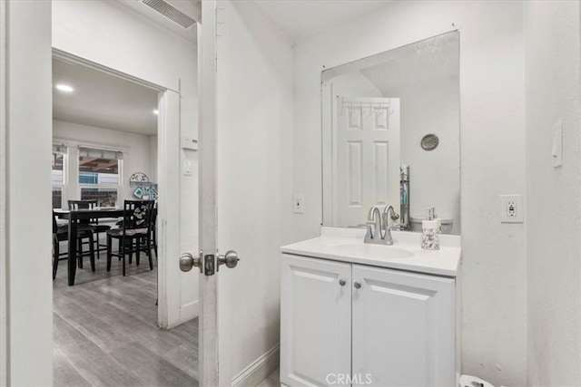 2838 N G St, San Bernardino, CA 92405 - bathroom featuring vanity and wood finished floors