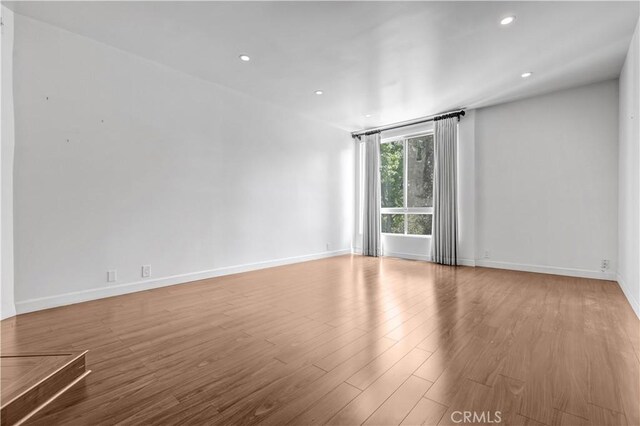 5333 Zelzah Ave Unit 203, Encino, CA 91316 - spare room featuring wood finished floors and recessed lighting