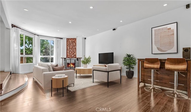 5333 Zelzah Ave Unit 203, Encino, CA 91316 - living room with wood finished floors, a fireplace, and recessed lighting