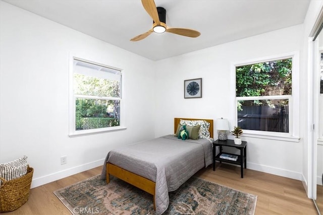 5447 Columbus Ave, Sherman Oaks, CA 91411 - bedroom with light wood finished floors and ceiling fan