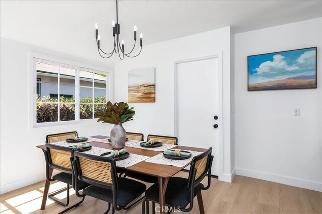 5447 Columbus Ave, Sherman Oaks, CA 91411 - dining room with a chandelier and light wood-style flooring
