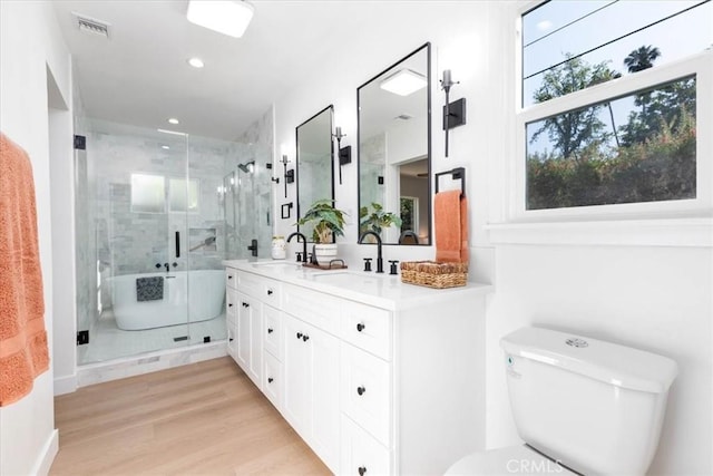 5447 Columbus Ave, Sherman Oaks, CA 91411 - full bath with double vanity, a stall shower, recessed lighting, and wood finished floors