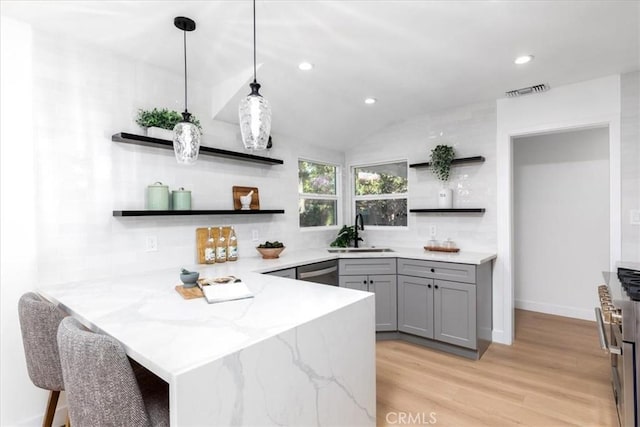 5447 Columbus Ave, Sherman Oaks, CA 91411 - kitchen featuring open shelves, gray cabinetry, a peninsula, appliances with stainless steel finishes, and recessed lighting