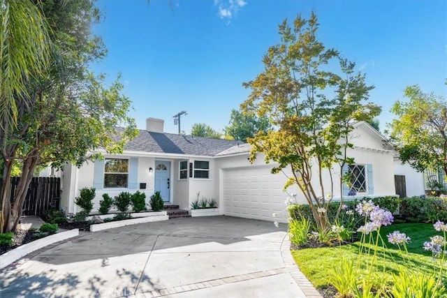 5447 Columbus Ave, Sherman Oaks, CA 91411 - ranch-style house with an attached garage, driveway, stucco siding, and a chimney