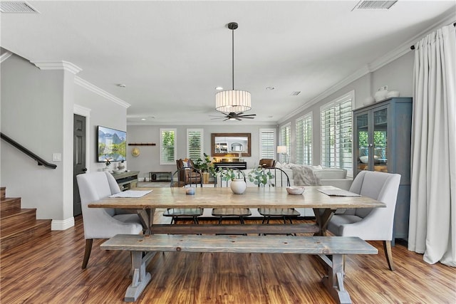 23763 Aspen, Murrieta, CA 92562 - dining area featuring wood finished floors, recessed lighting, crown molding, and stairway
