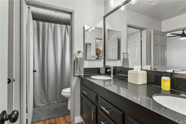 23763 Aspen, Murrieta, CA 92562 - full bath featuring double vanity, wood finished floors, and curtained shower