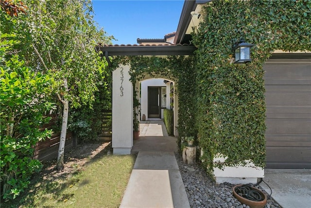 23763 Aspen, Murrieta, CA 92562 - view of exterior entry featuring a tile roof and stucco siding