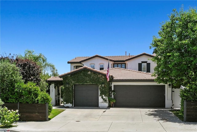 23763 Aspen, Murrieta, CA 92562 - mediterranean / spanish house with a garage, driveway, a tile roof, and stucco siding