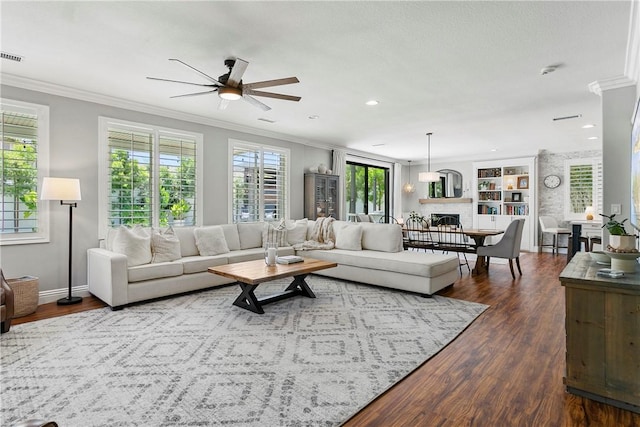 23763 Aspen, Murrieta, CA 92562 - living area featuring crown molding, ceiling fan, a fireplace, dark wood-type flooring, and recessed lighting