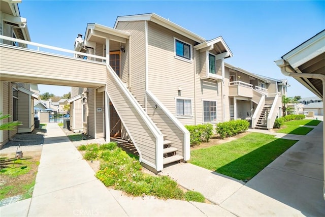 1867 W Falmouth Ave Unit 60, Anaheim, CA 92801 - view of building exterior featuring stairway and a residential view
