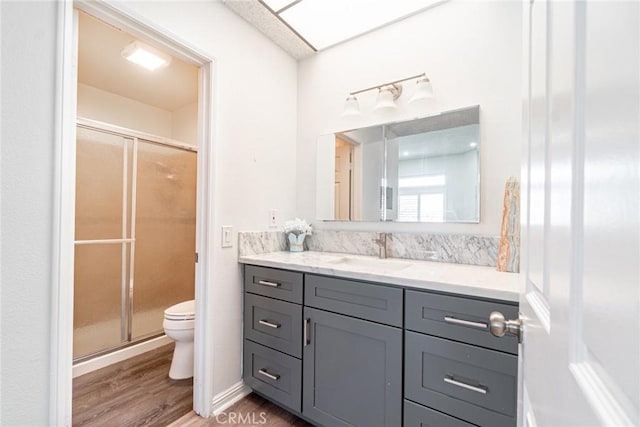 1867 W Falmouth Ave Unit 60, Anaheim, CA 92801 - full bath featuring vanity, a stall shower, and wood finished floors