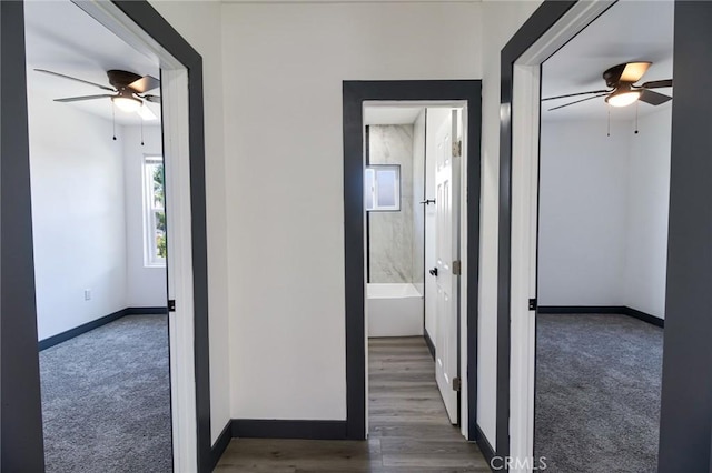 1235 Spruce St, San Bernardino, CA 92411 - hallway with carpet floors and wood finished floors