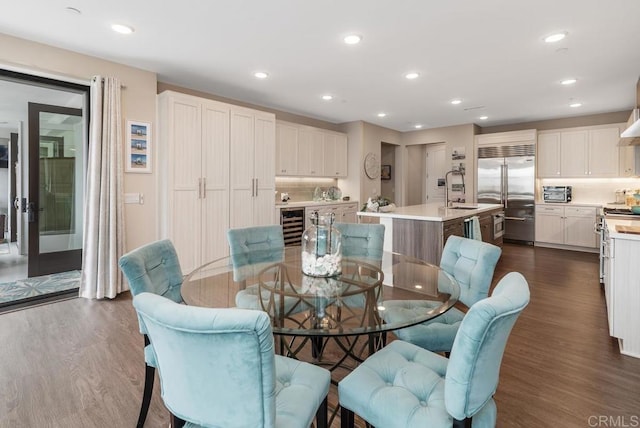 800 Grand Ave Unit 105, Carlsbad, CA 92008 - dining area featuring dark wood-style floors, recessed lighting, and beverage cooler