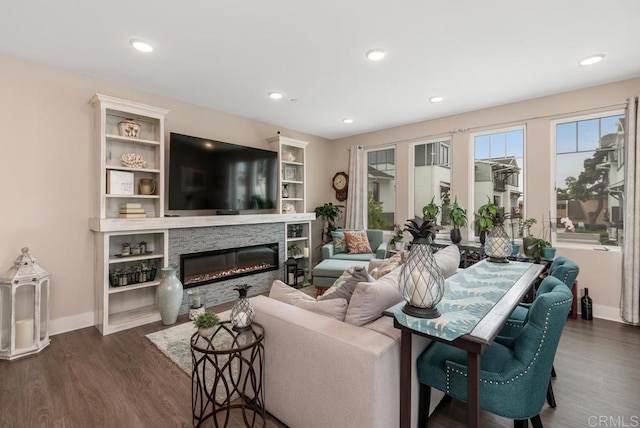 800 Grand Ave Unit 105, Carlsbad, CA 92008 - living room featuring dark wood-style flooring, a glass covered fireplace, and recessed lighting