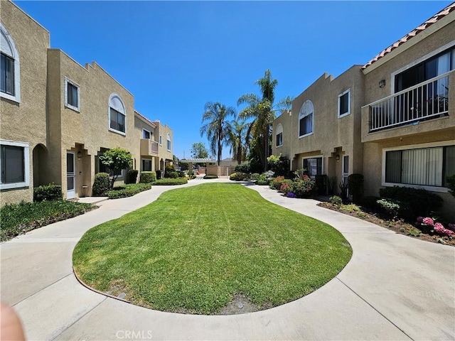 13171 Newland St Unit 11, Garden Grove, CA 92844 - surrounding community featuring a residential view and a lawn