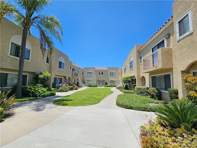 13171 Newland St Unit 11, Garden Grove, CA 92844 - surrounding community featuring a residential view and a lawn