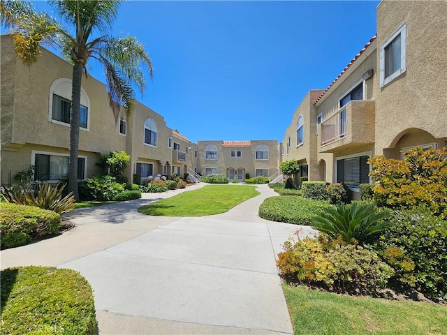 13171 Newland St Unit 11, Garden Grove, CA 92844 - surrounding community featuring a residential view and a lawn