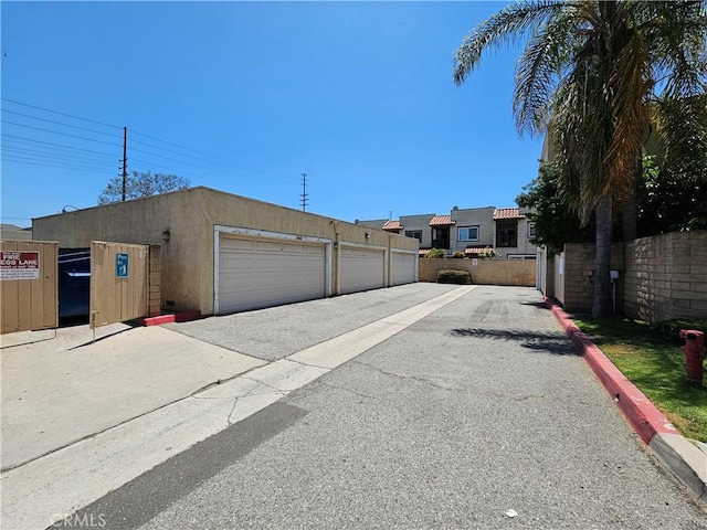 13171 Newland St Unit 11, Garden Grove, CA 92844 - view of street featuring community garages