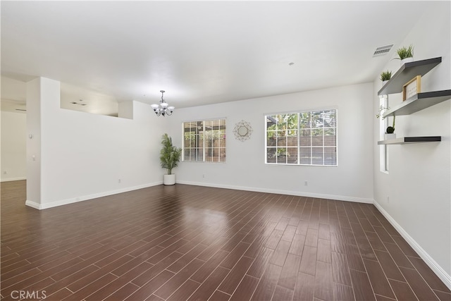 17129 Lacebark St, Fontana, CA 92337 - unfurnished living room featuring a chandelier and dark wood-style flooring