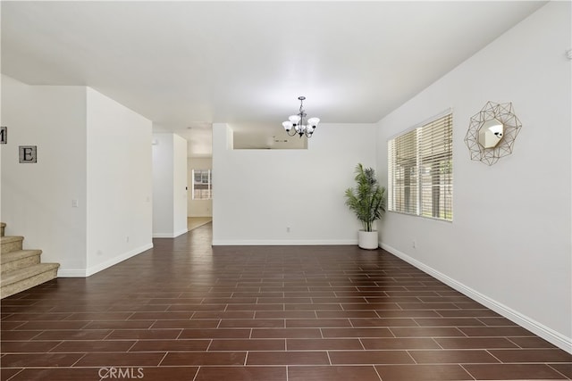 17129 Lacebark St, Fontana, CA 92337 - spare room with a chandelier and stairs