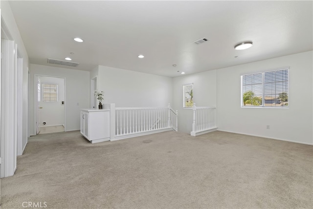 17129 Lacebark St, Fontana, CA 92337 - unfurnished room featuring light colored carpet, plenty of natural light, and recessed lighting