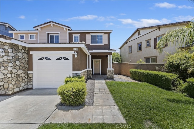 17129 Lacebark St, Fontana, CA 92337 - view of front of house featuring a garage, stucco siding, and concrete driveway